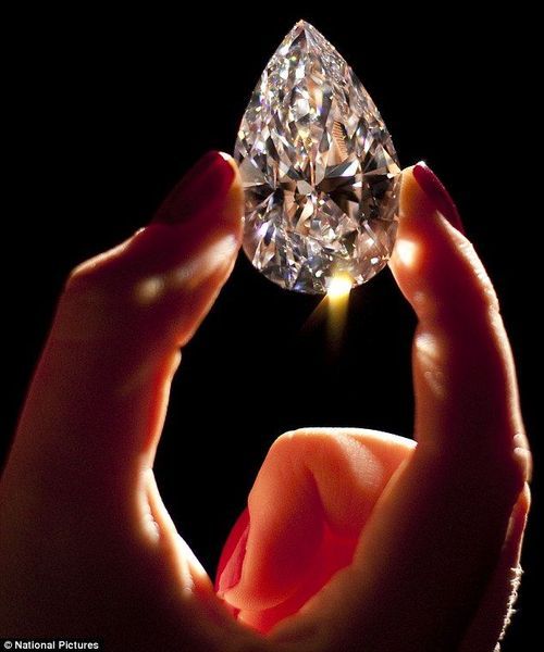 hand holding a large diamond