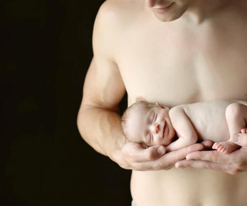 man holding baby